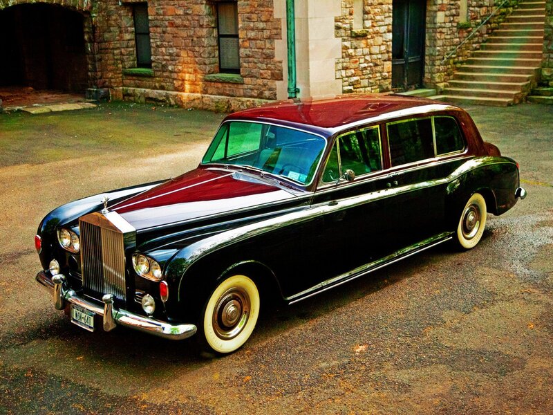 Classic Rolls-Royce in front of stone building