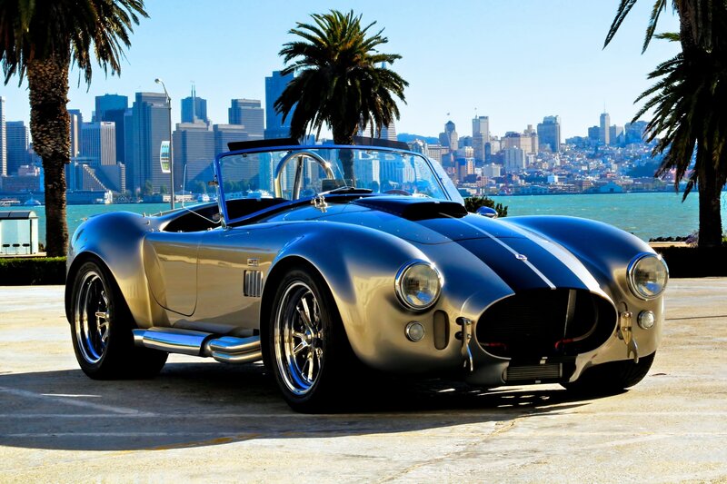 Classic silver sports car by the bay