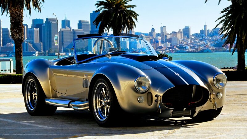 Classic silver sports car by the bay