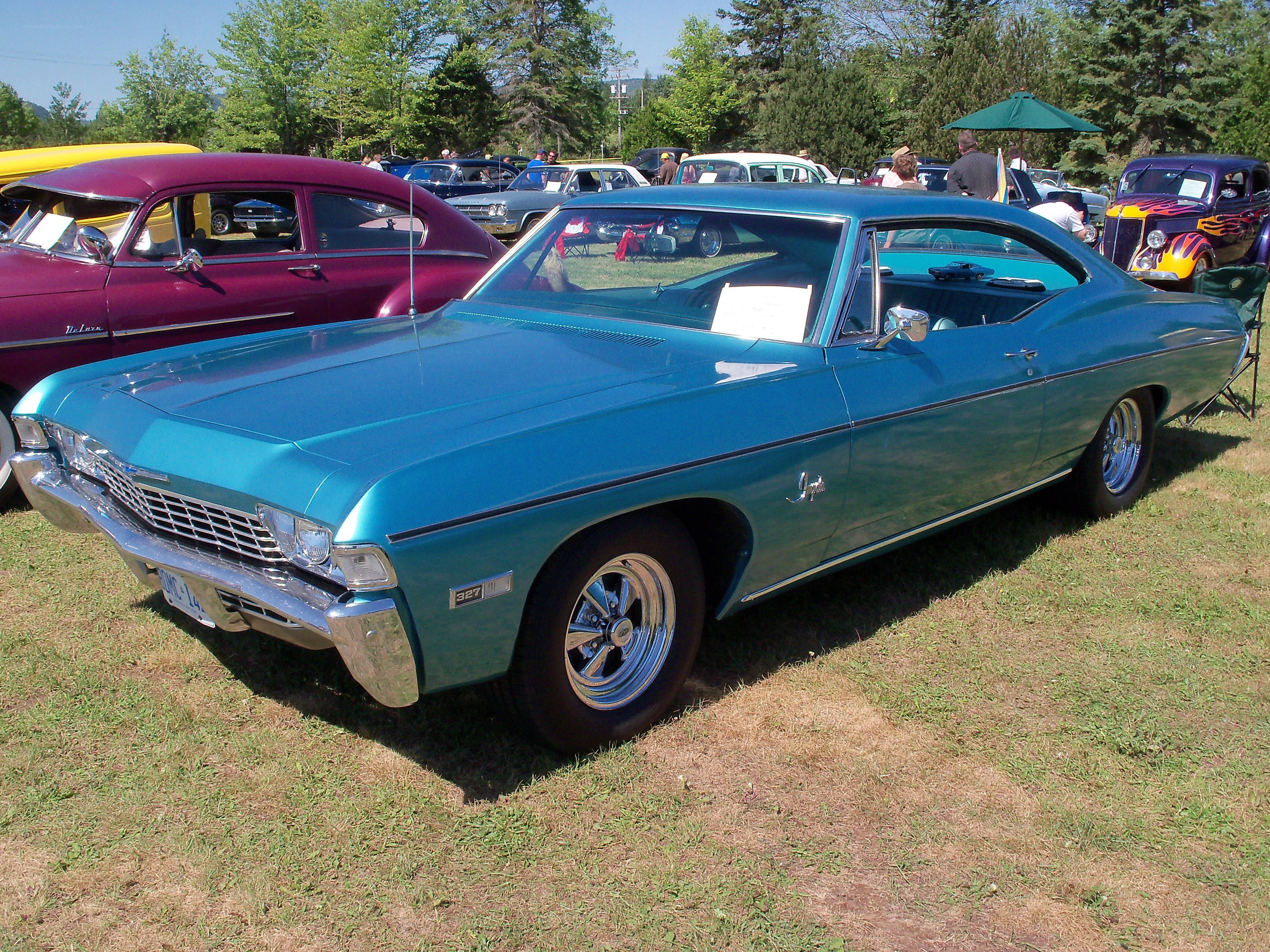 Classic teal car at a show