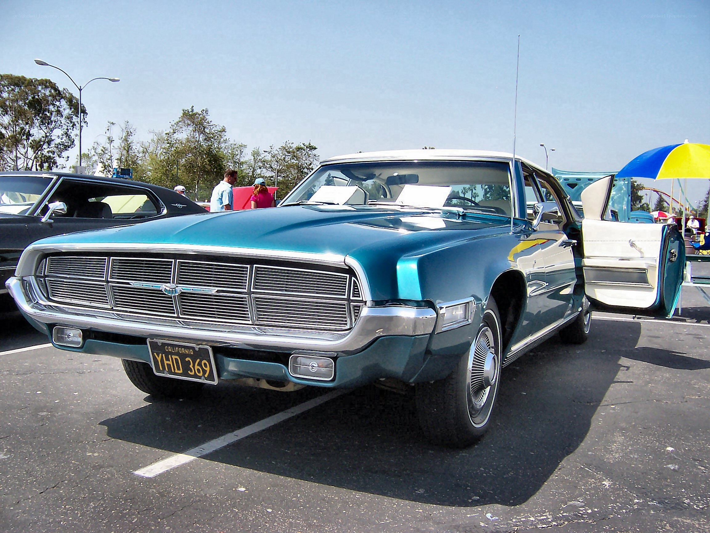Classic teal car at a show