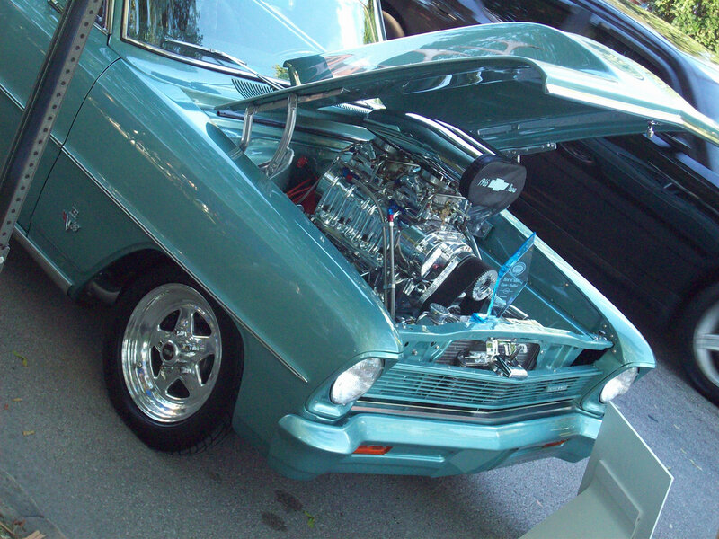 classic teal car with open hood