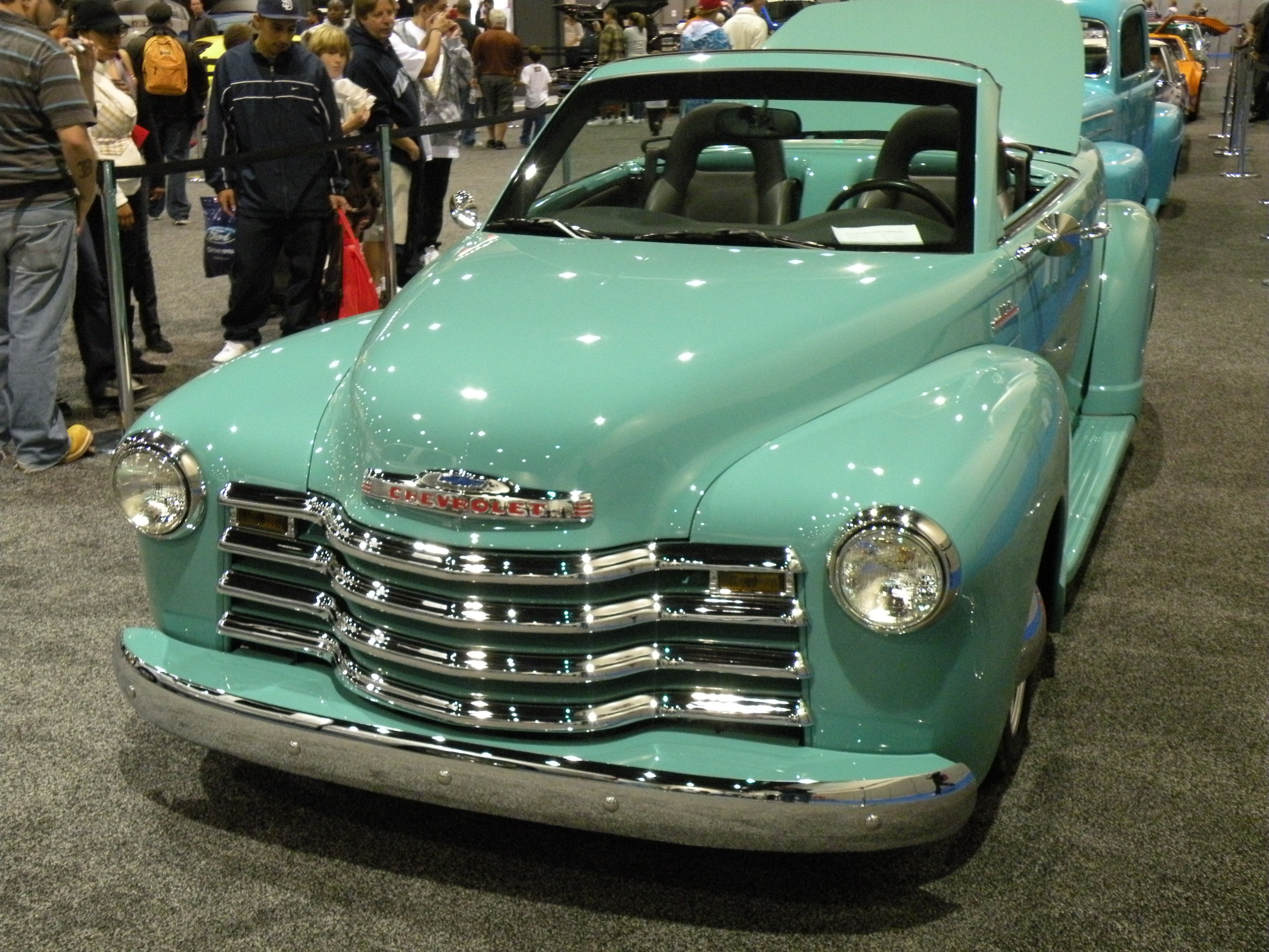 Classic teal Chevrolet convertible