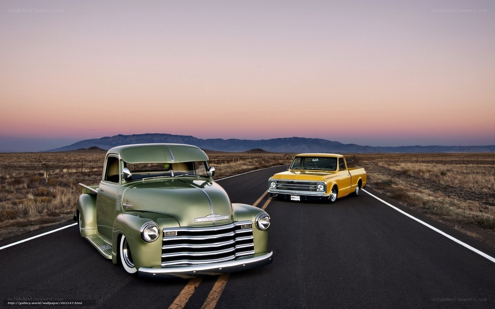 Classic trucks on desert road