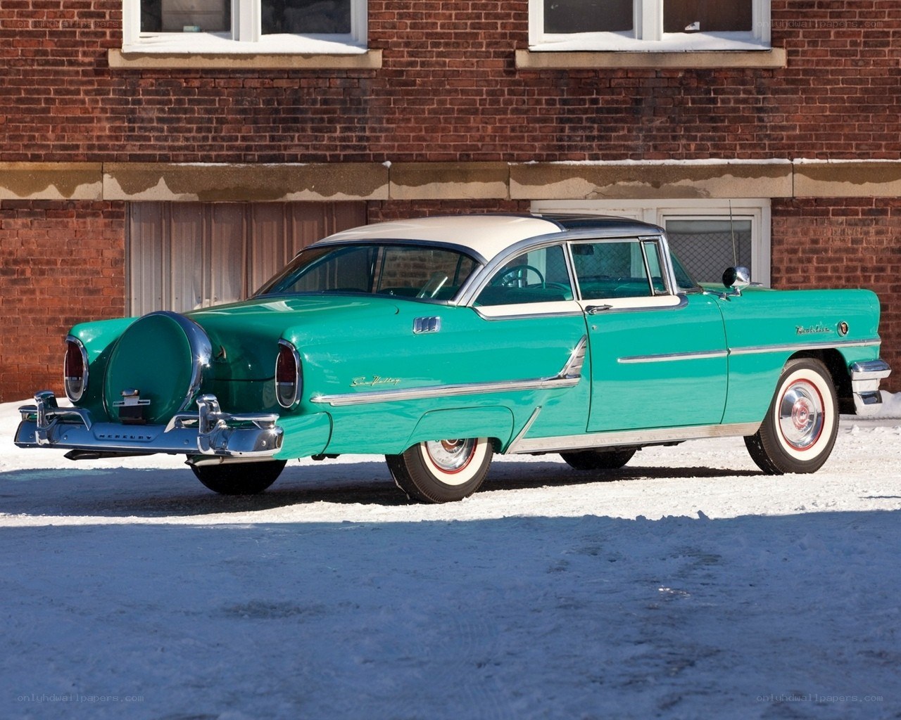 Classic turquoise car in winter