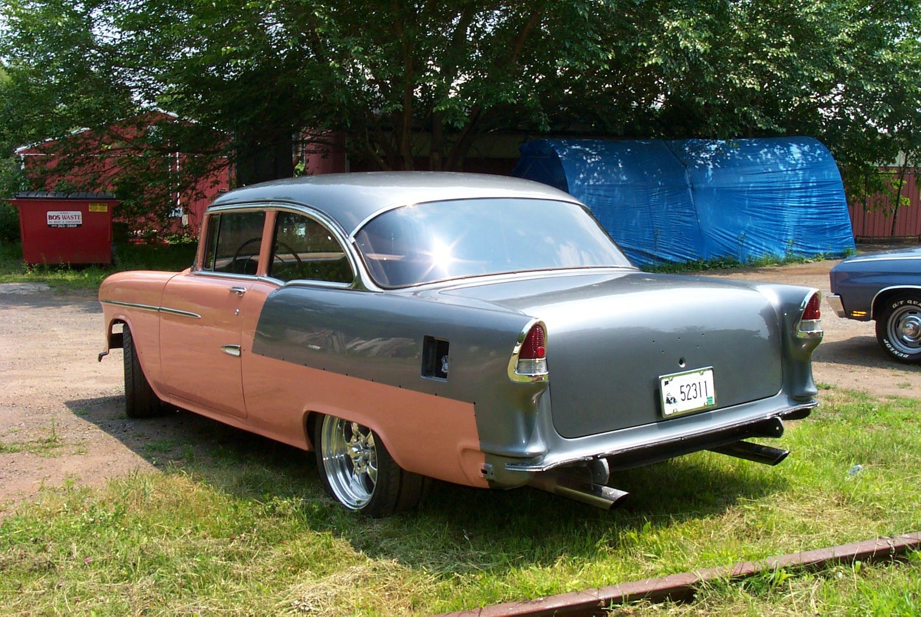 Classic two-tone car in yard