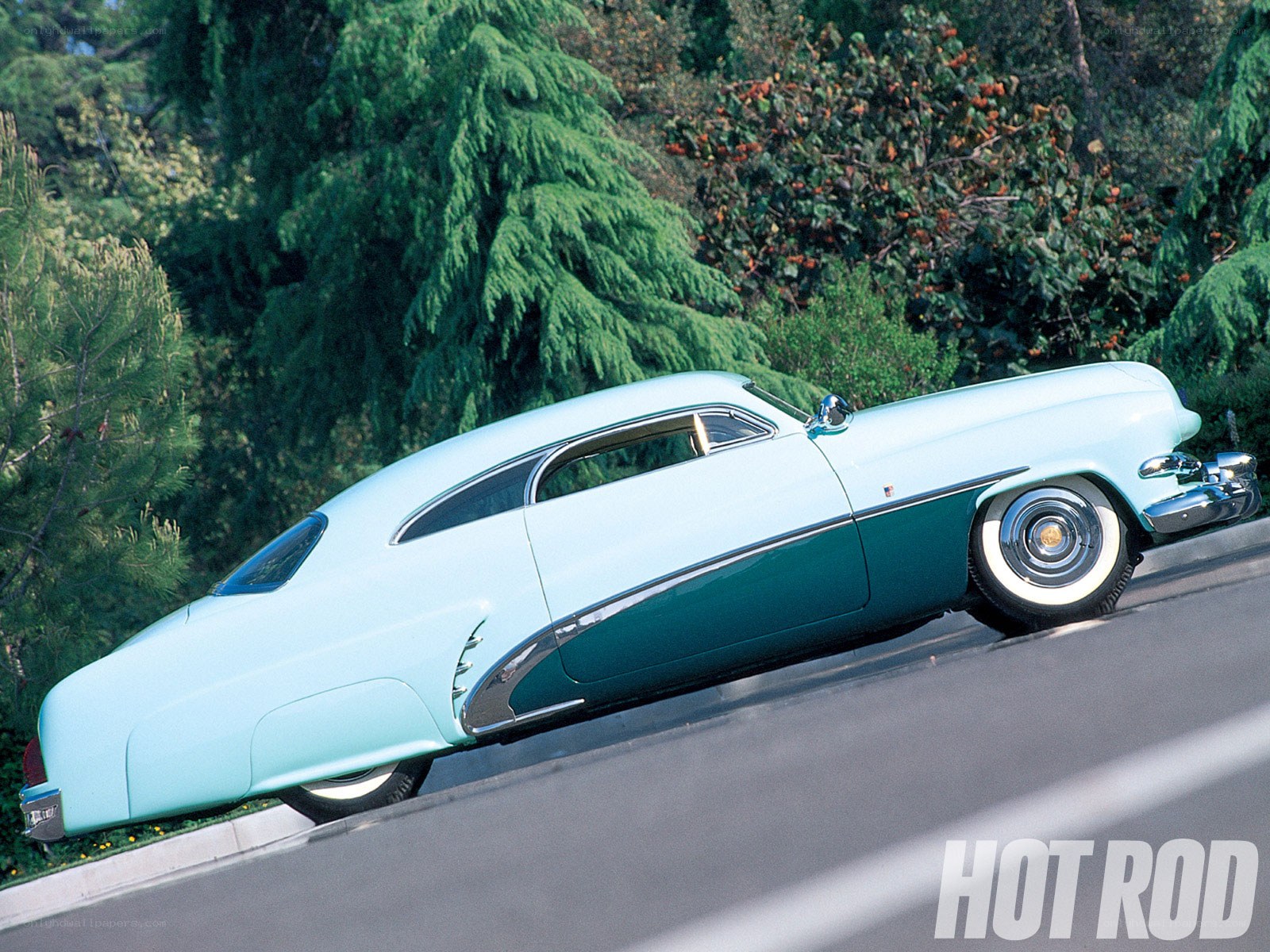 Classic two-tone car on road