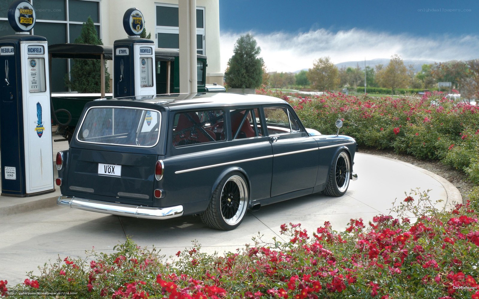Classic Volvo station wagon at gas station