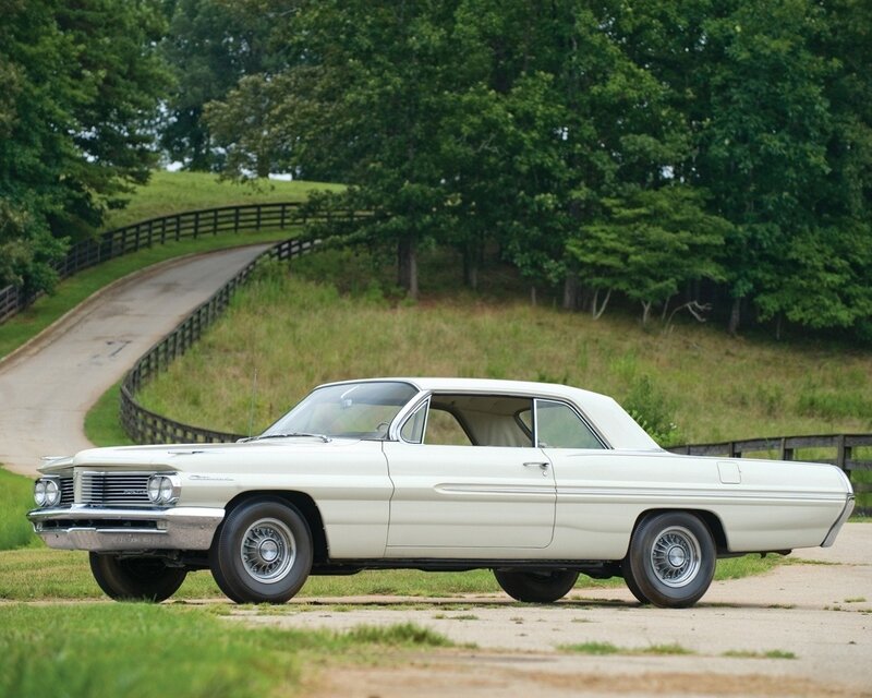 Classic white car on a country road