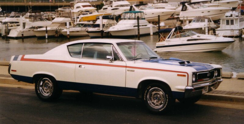 Classic white muscle car at marina
