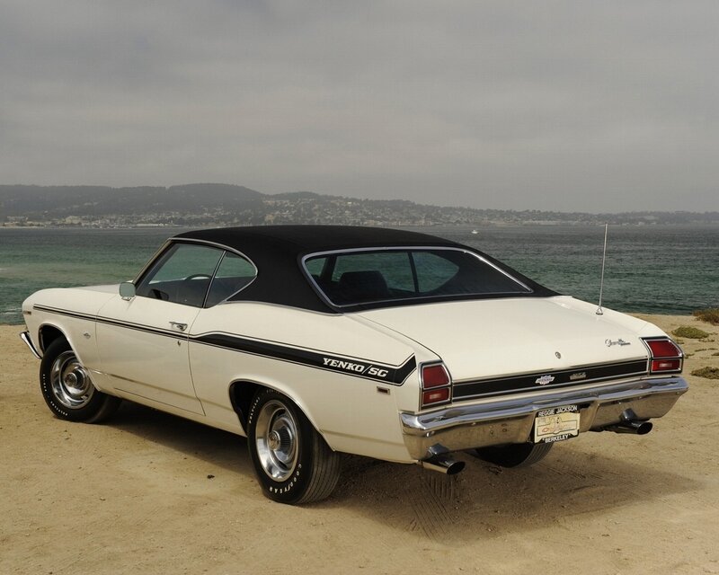 Classic white muscle car on beach