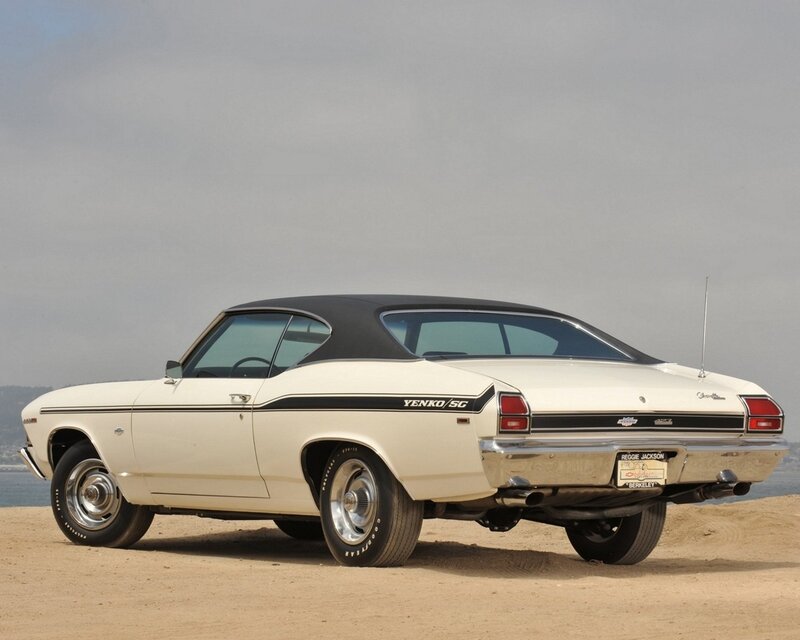 Classic white muscle car on beach