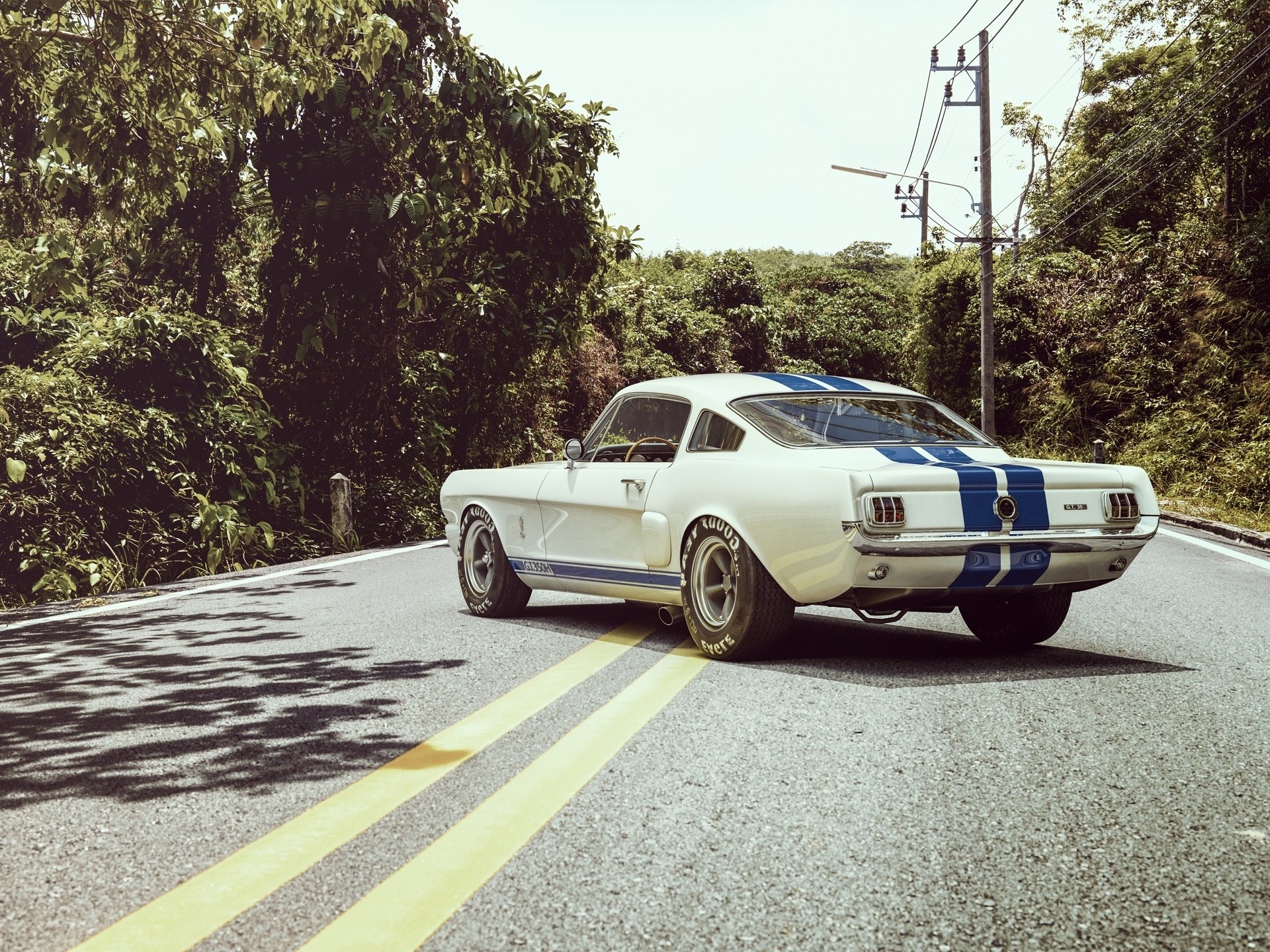 Classic white Mustang on a road