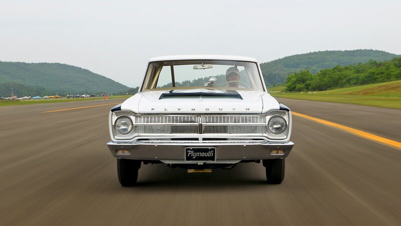 Classic white Plymouth on a runway