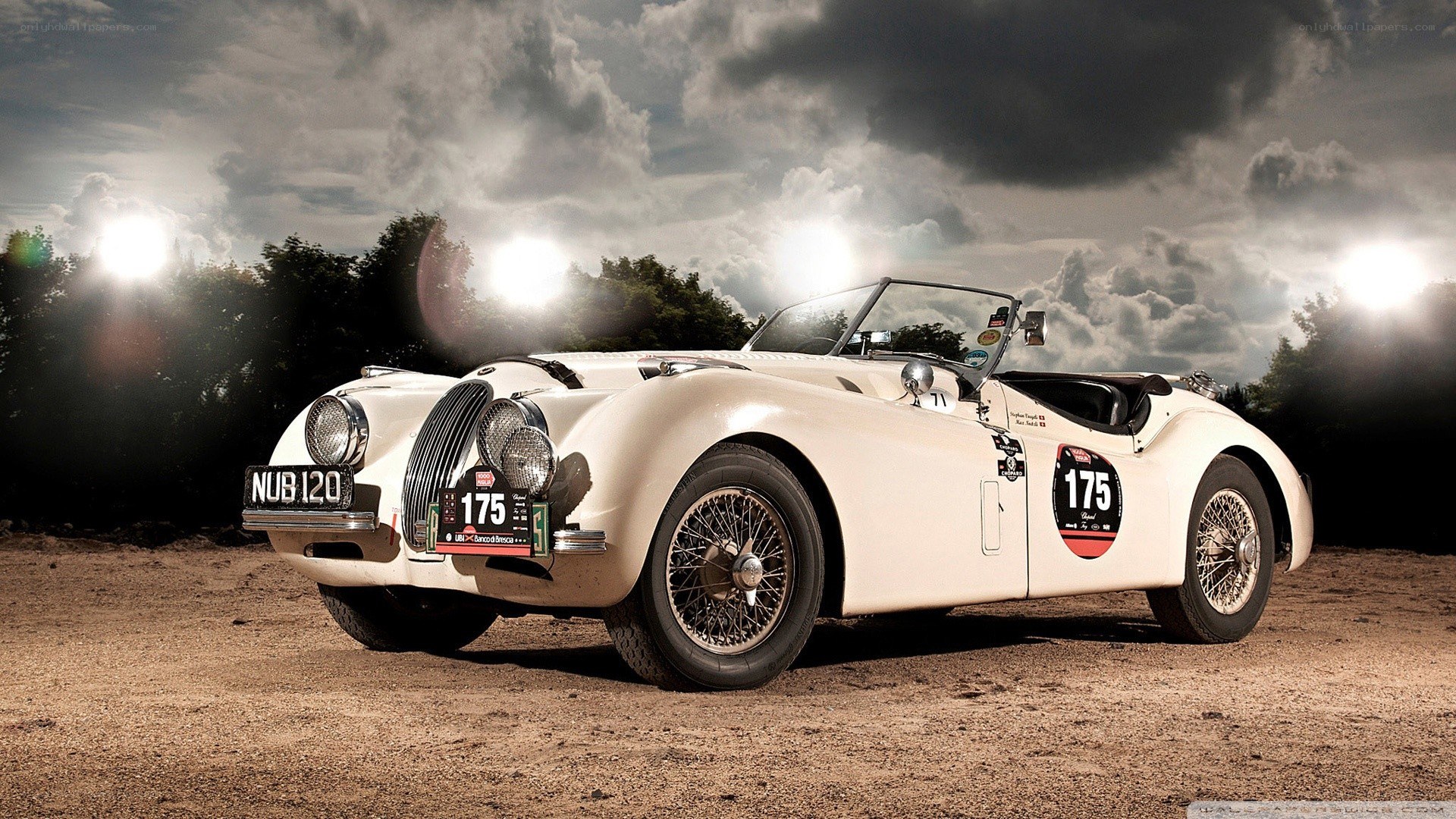 Classic white race car on dirt