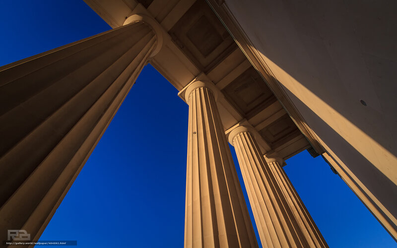 Classical columns against blue sky