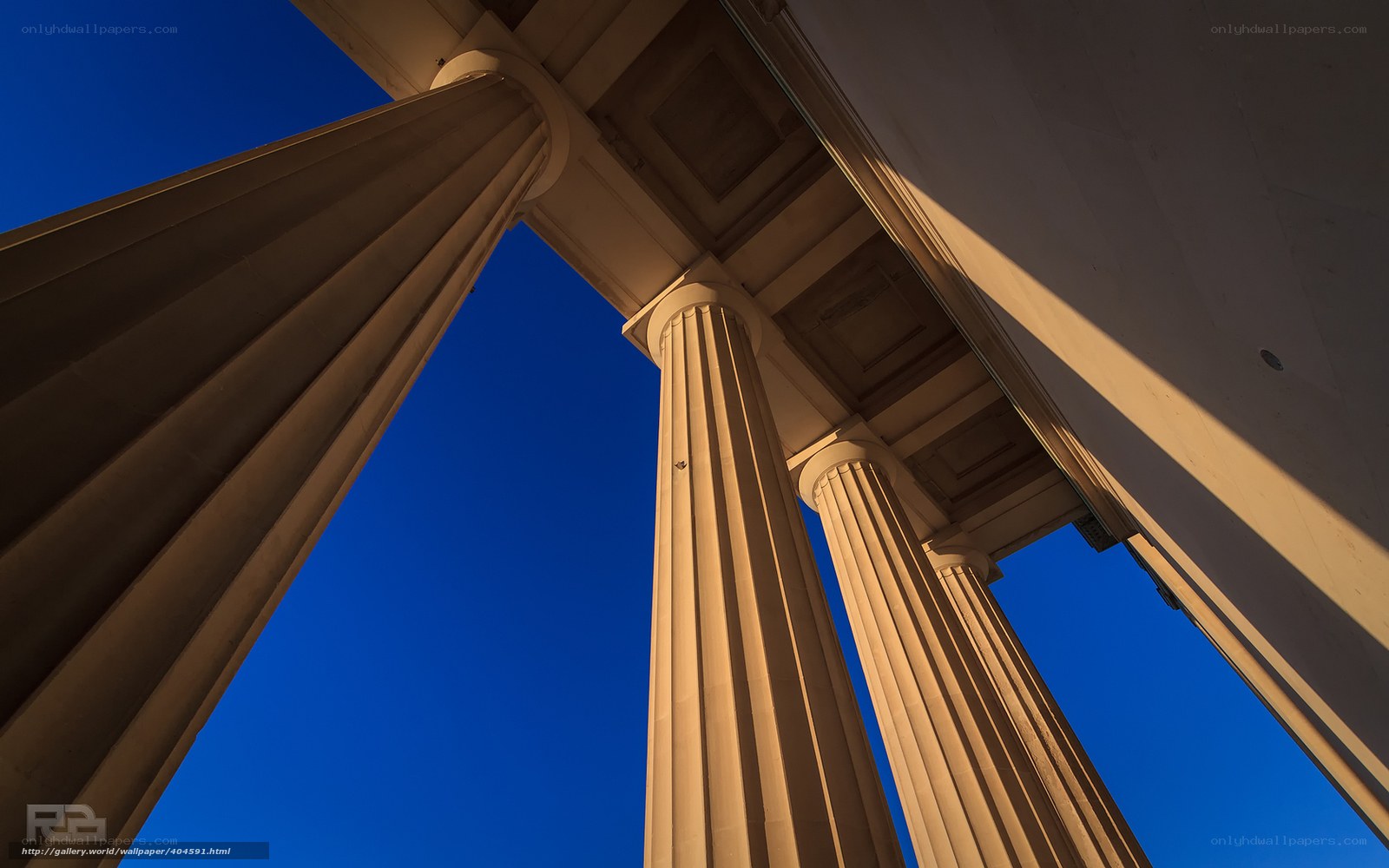 Classical columns against blue sky