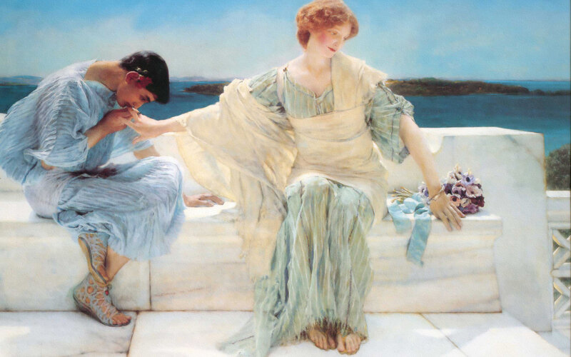 Classical figures by the sea