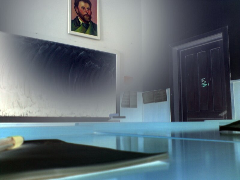 Classroom with portrait and chalkboard