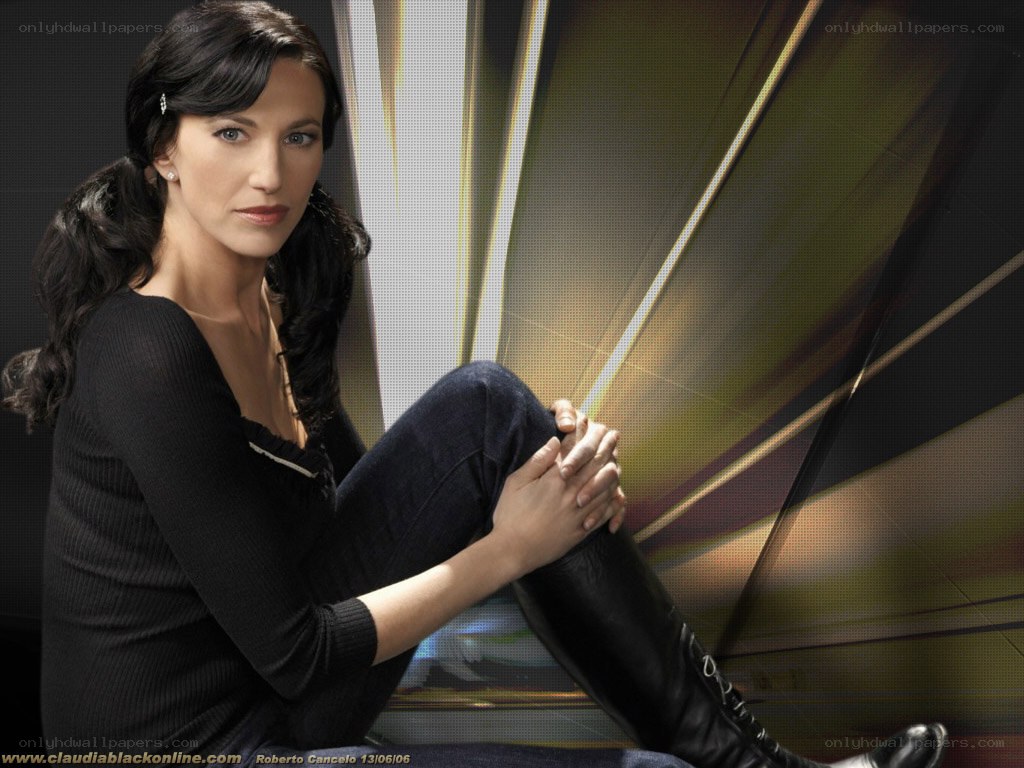 Claudia Black in black attire