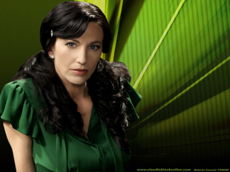 Claudia Black in green