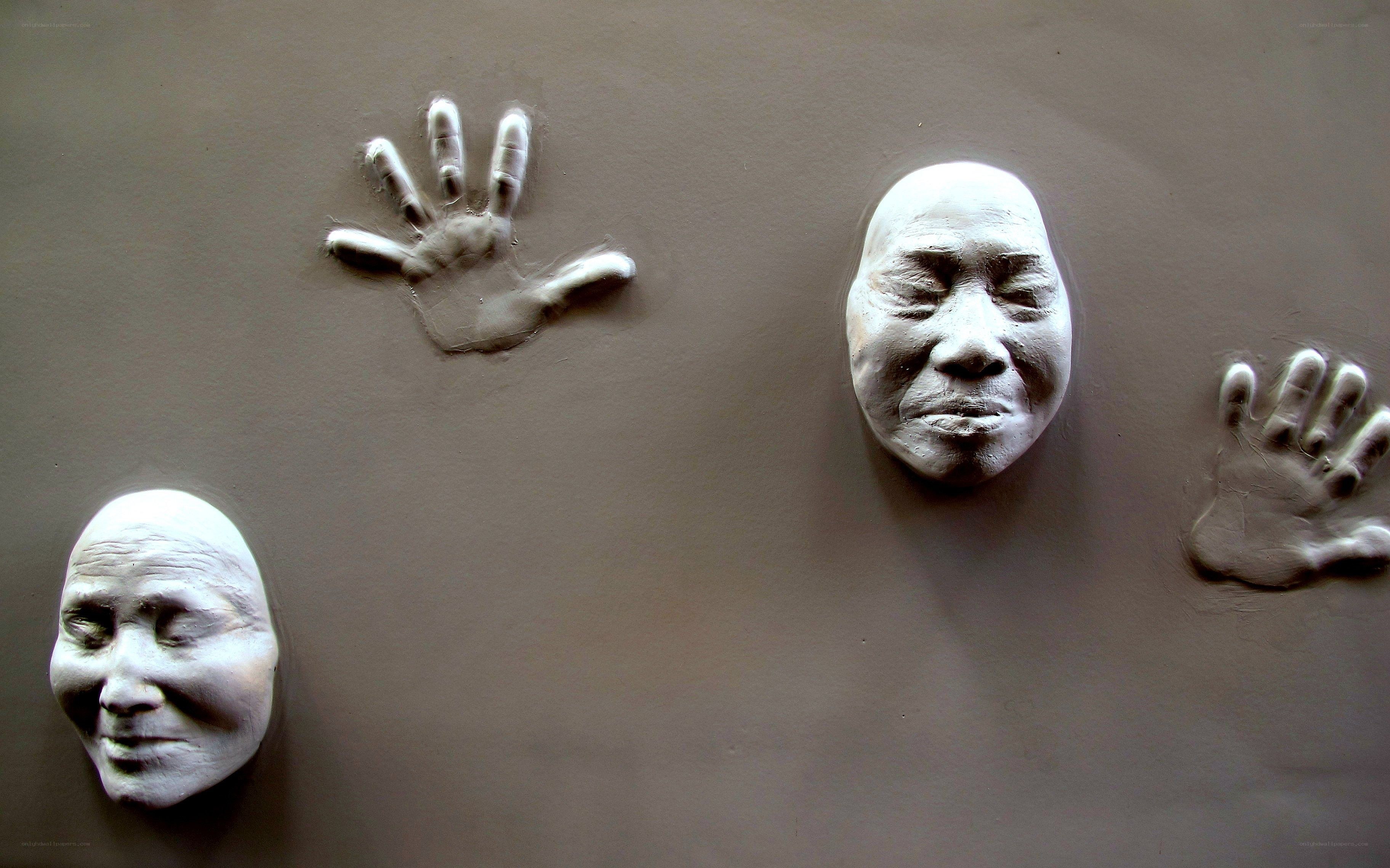 clay hand and face impressions