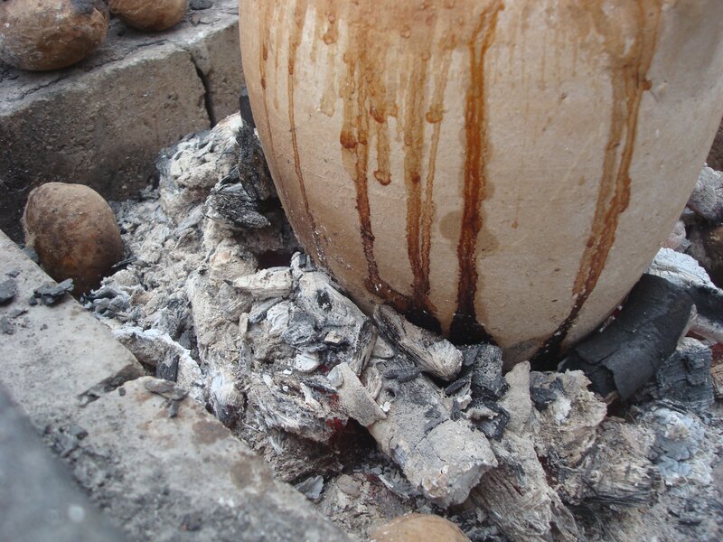 clay pot over coals
