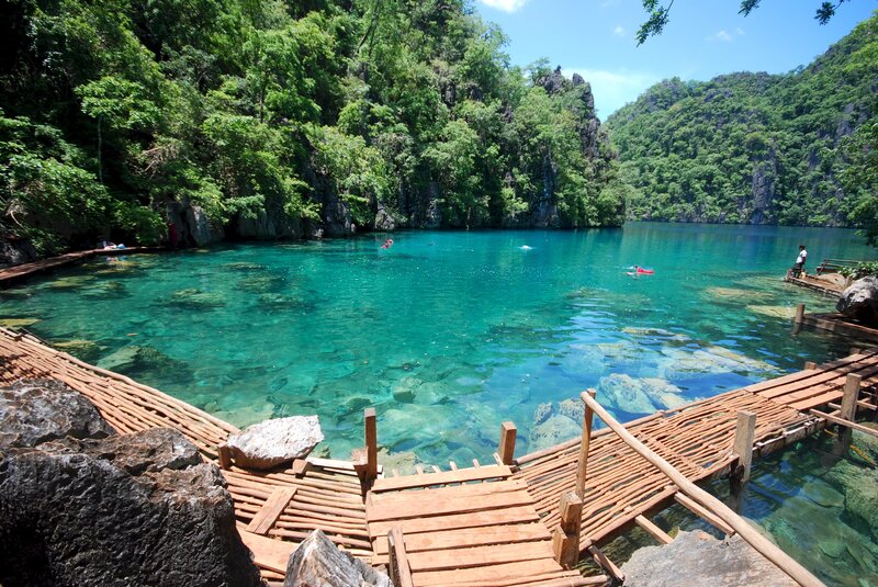 Clear blue lagoon with wooden walkway