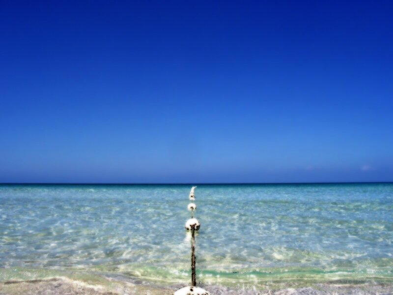 Clear blue ocean with buoy