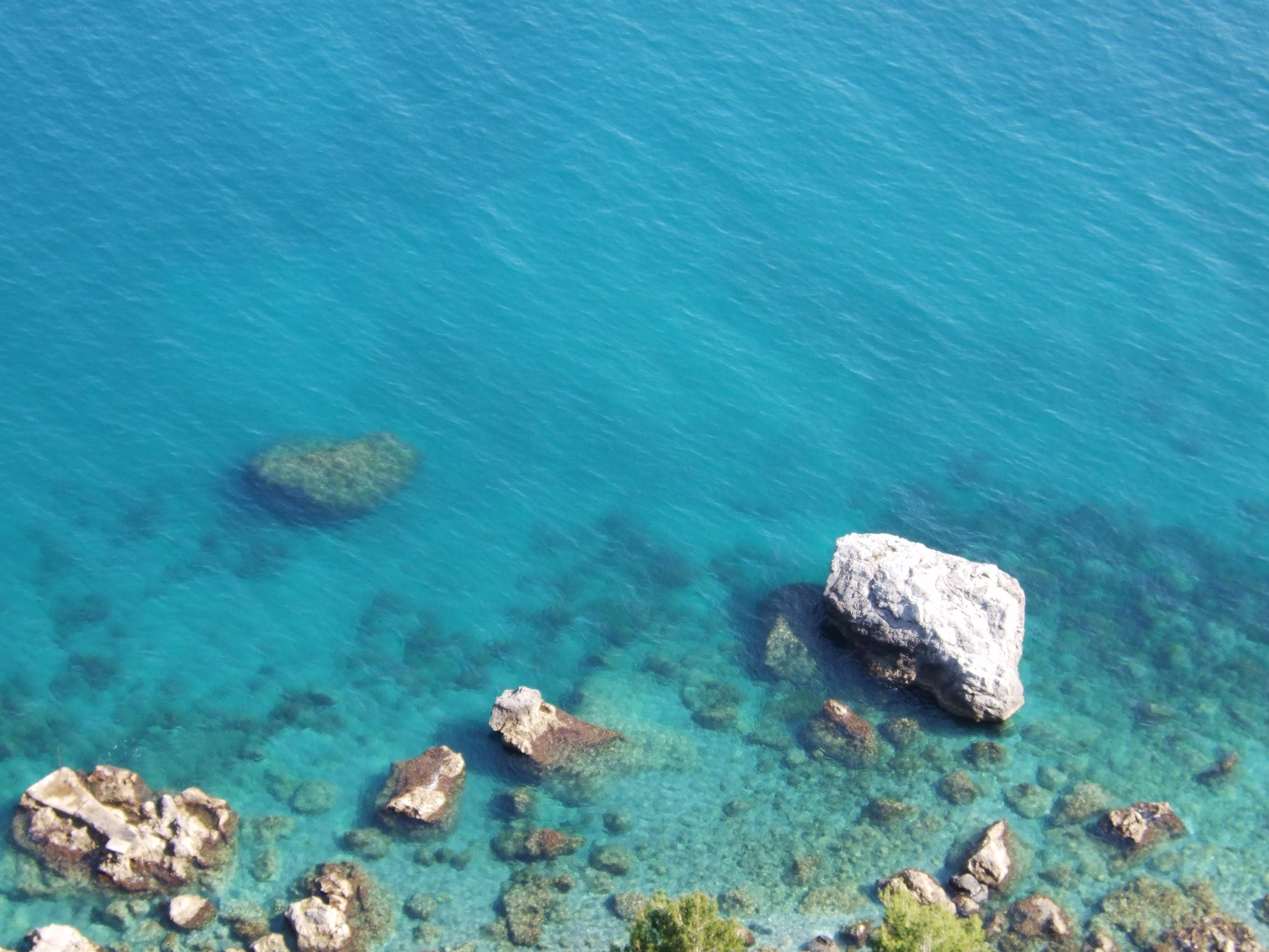 Clear blue sea with rocks