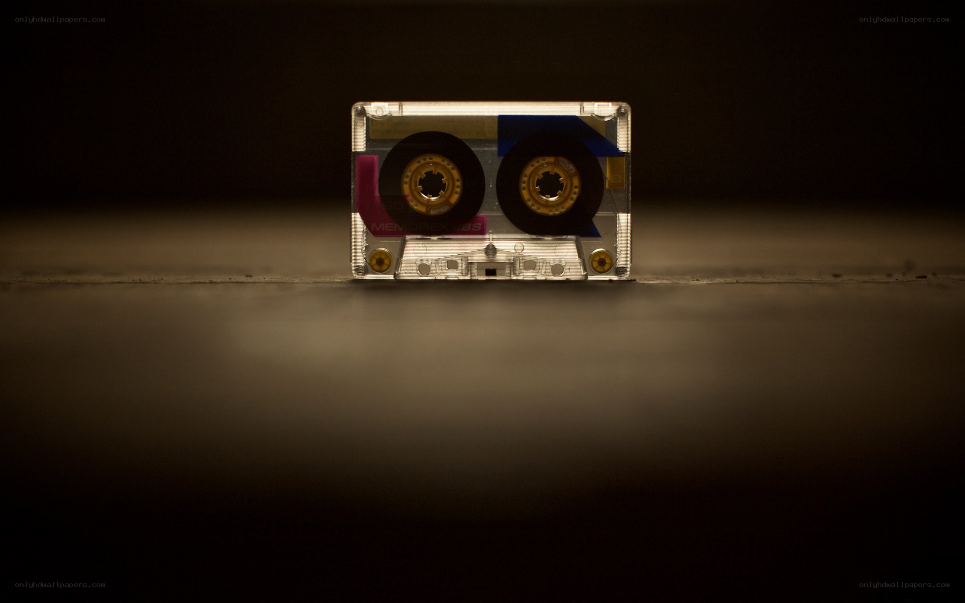 Clear cassette tape on dark surface