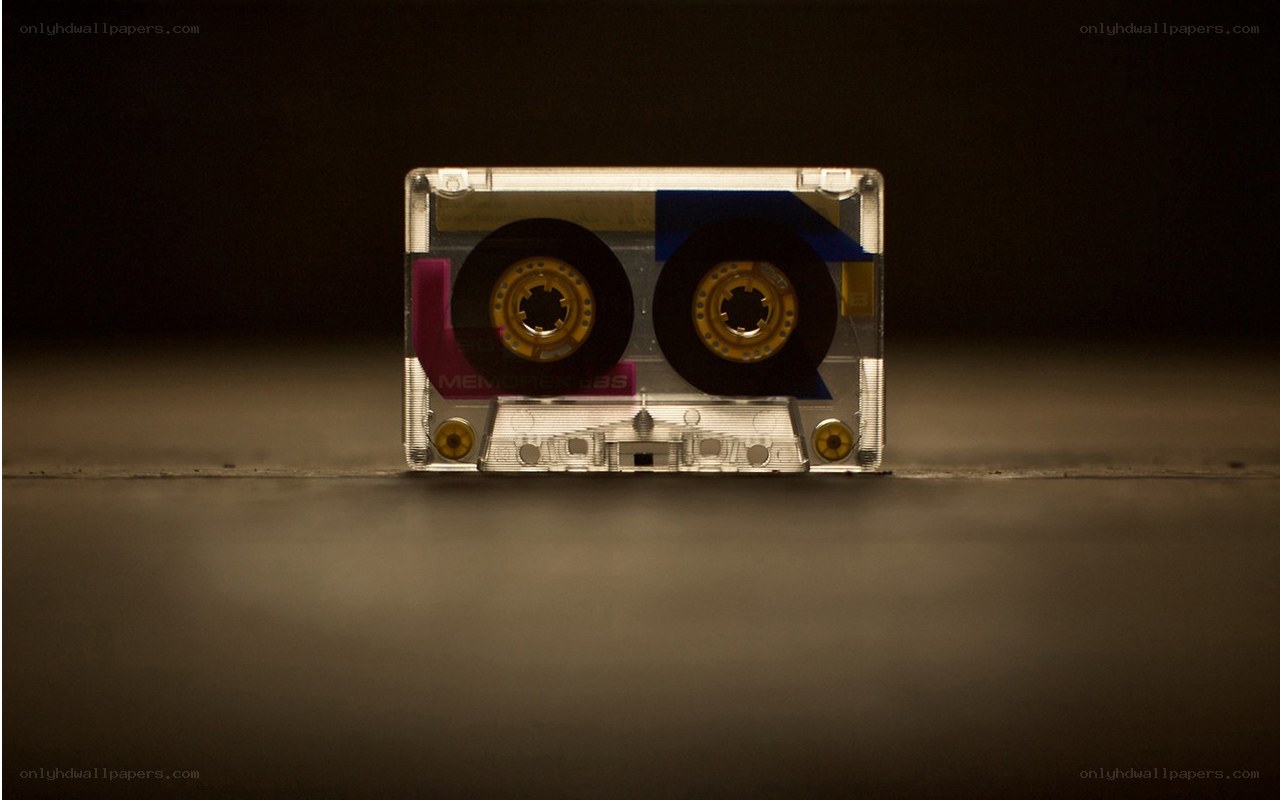 Clear cassette tape on dark surface