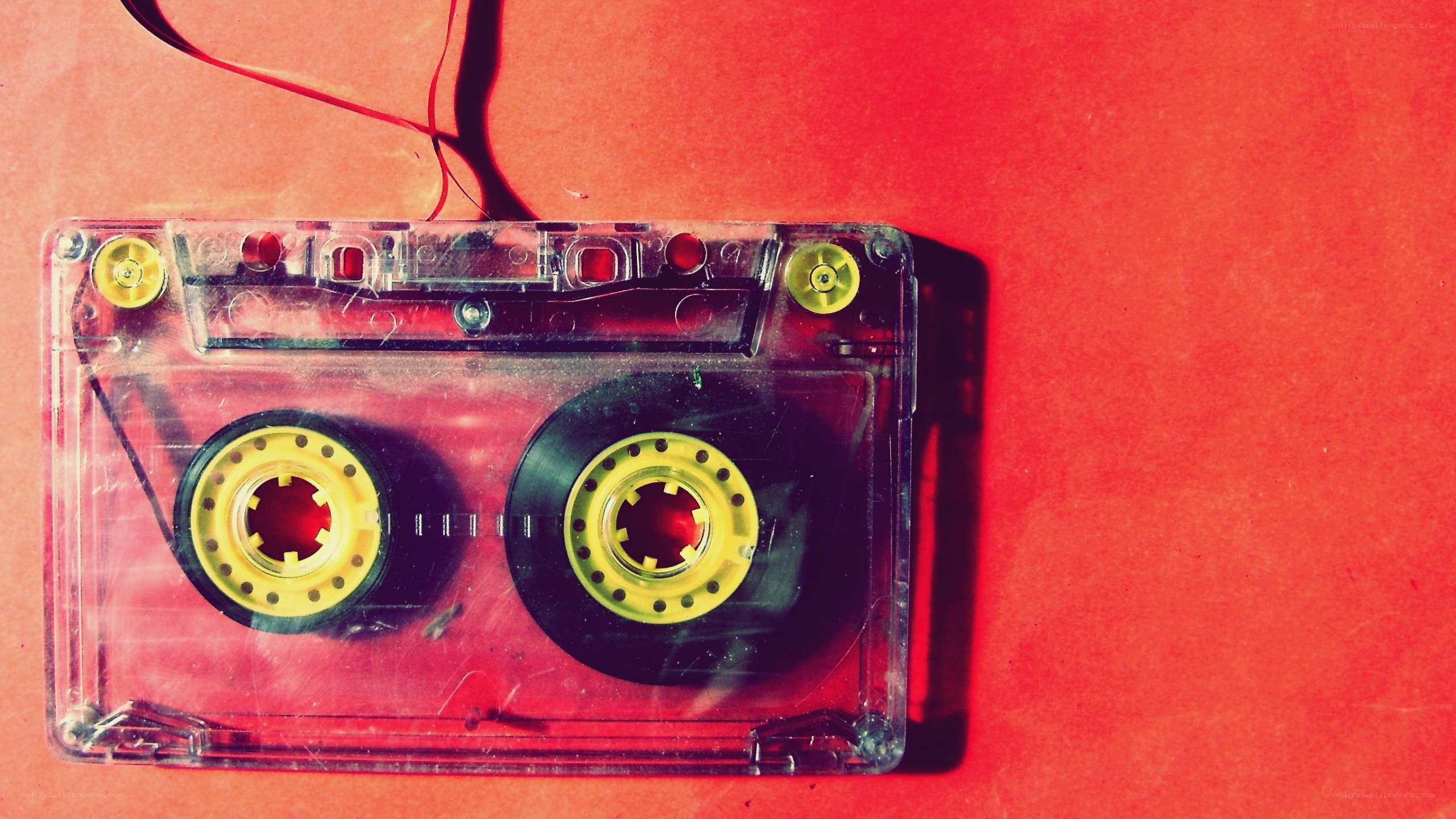 Clear cassette tape on red
