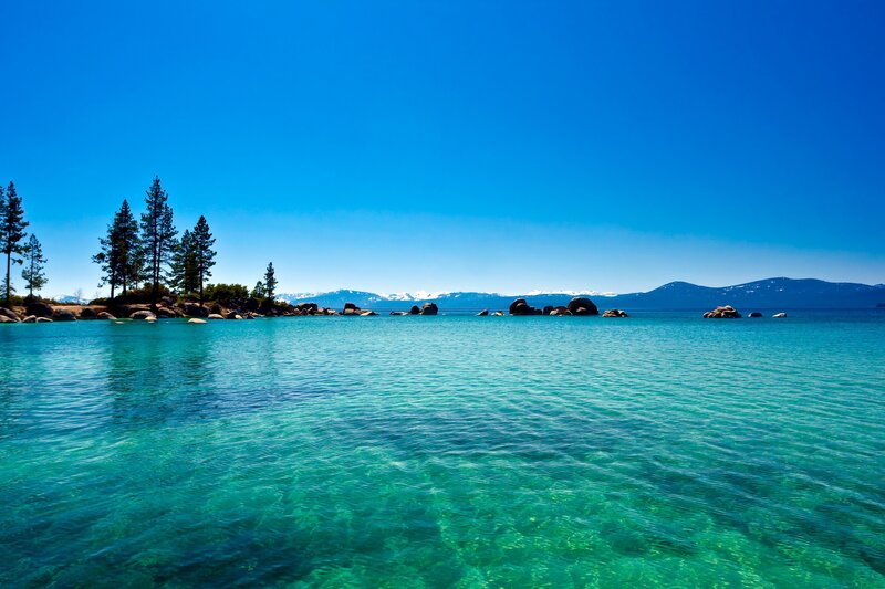 Clear Lake Water — Blue, Serene, Afternoon, Photograph, Trees, Rocks