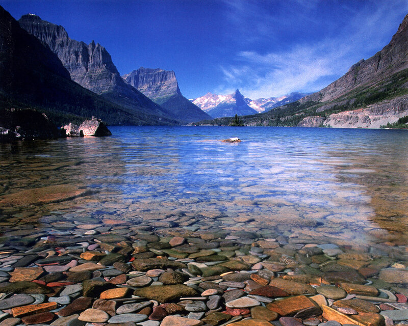 Clear lake with mountain backdrop