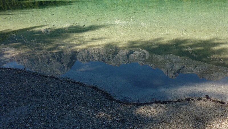 Clear lake with mountain reflection