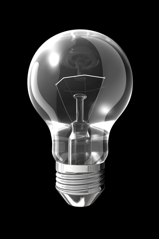 Clear light bulb on black