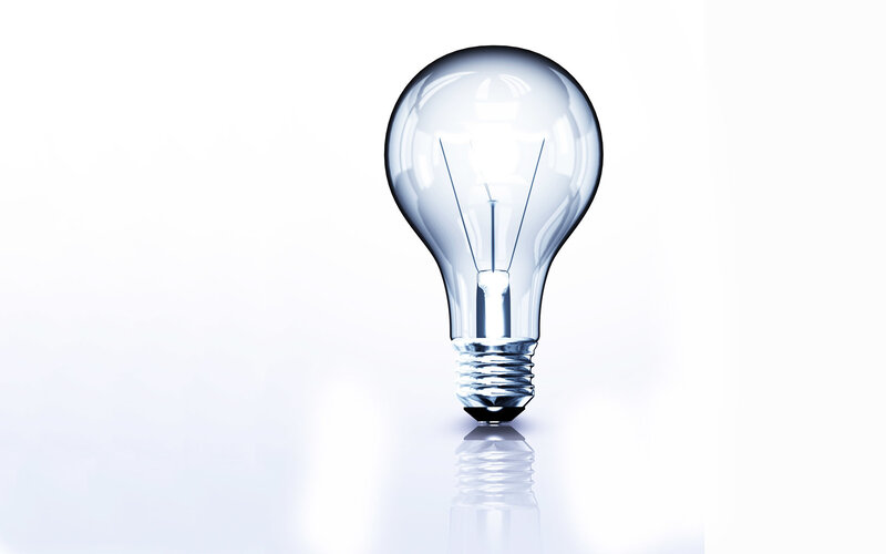 Clear light bulb on white