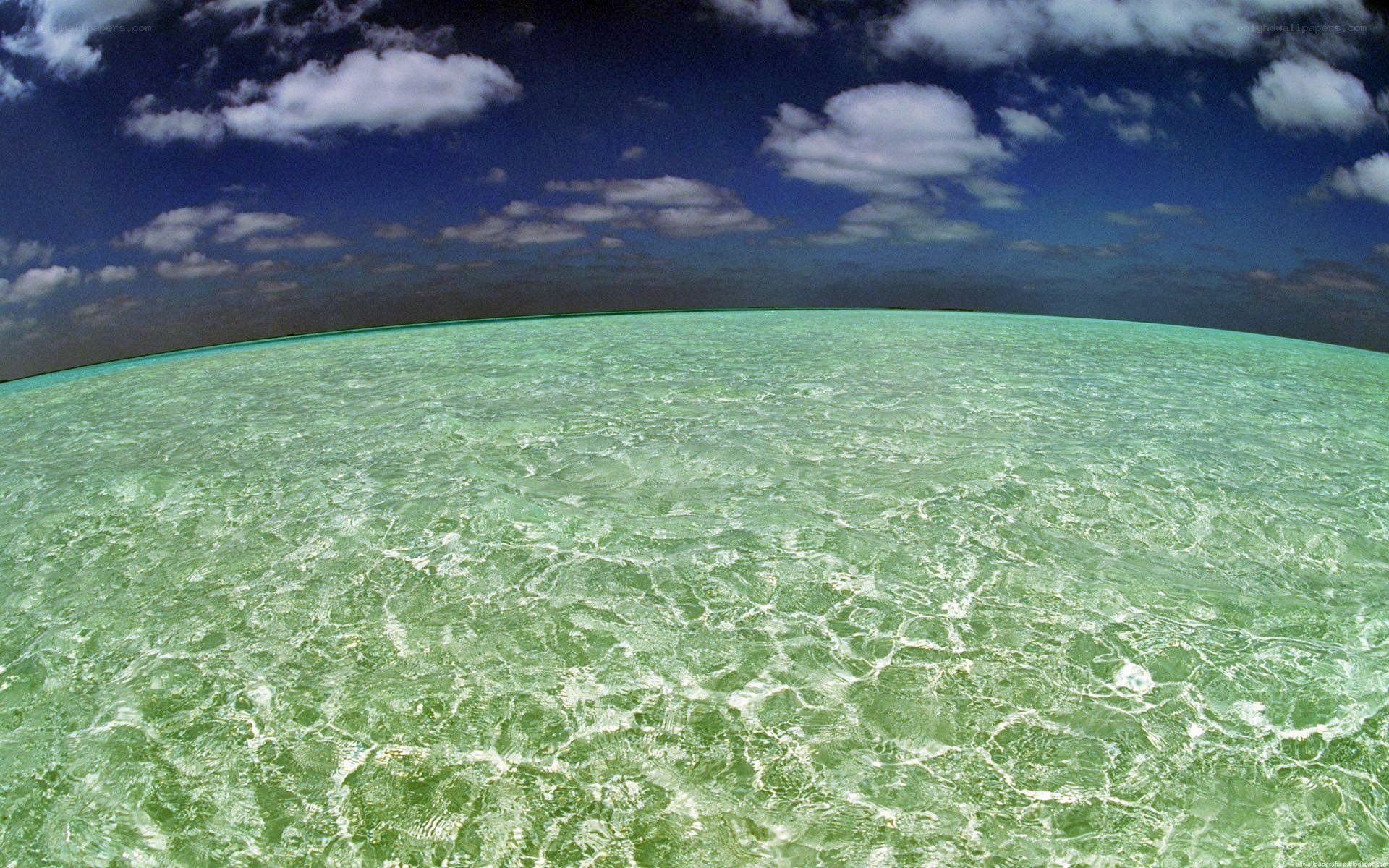 Clear ocean water under blue sky