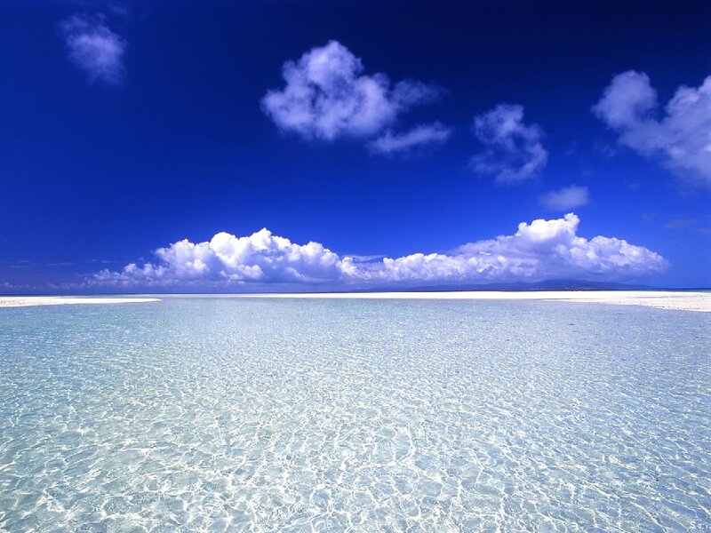 Clear ocean waters under blue sky