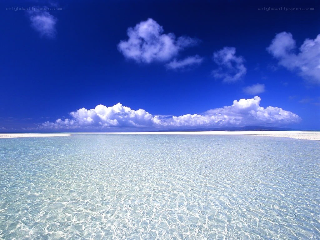 Clear ocean waters under blue sky