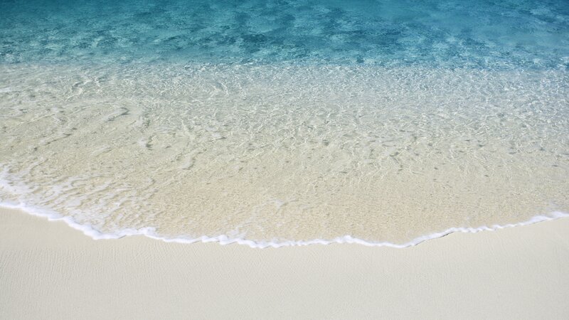 Clear Ocean Waves on Sand