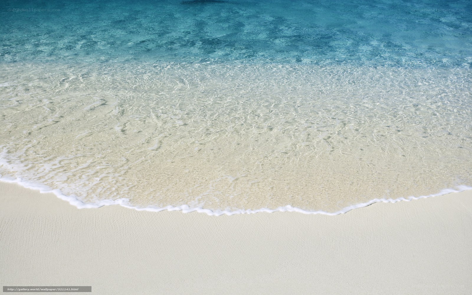 clear ocean waves on white sand