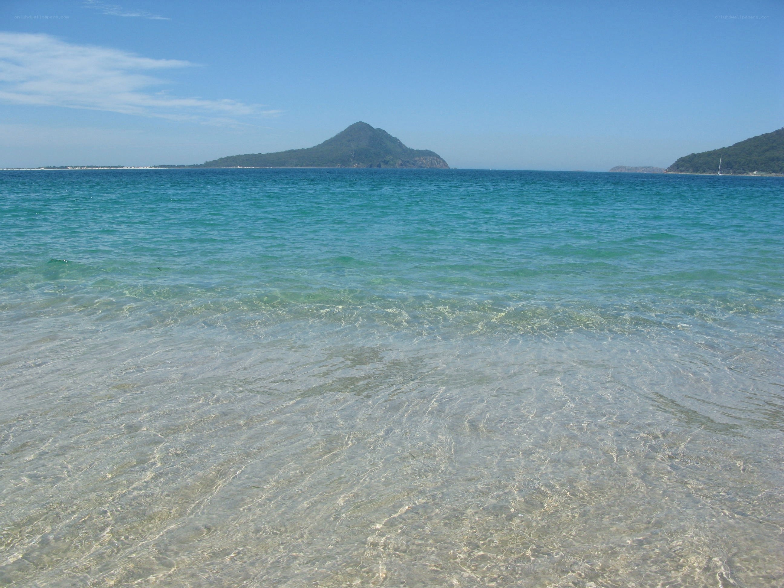 Clear ocean with distant island