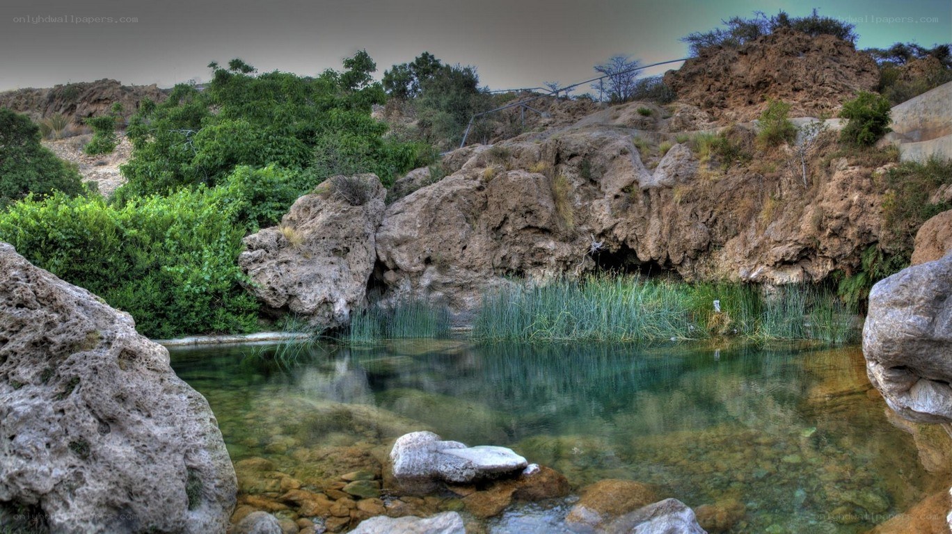 Clear pool in rocky landscape