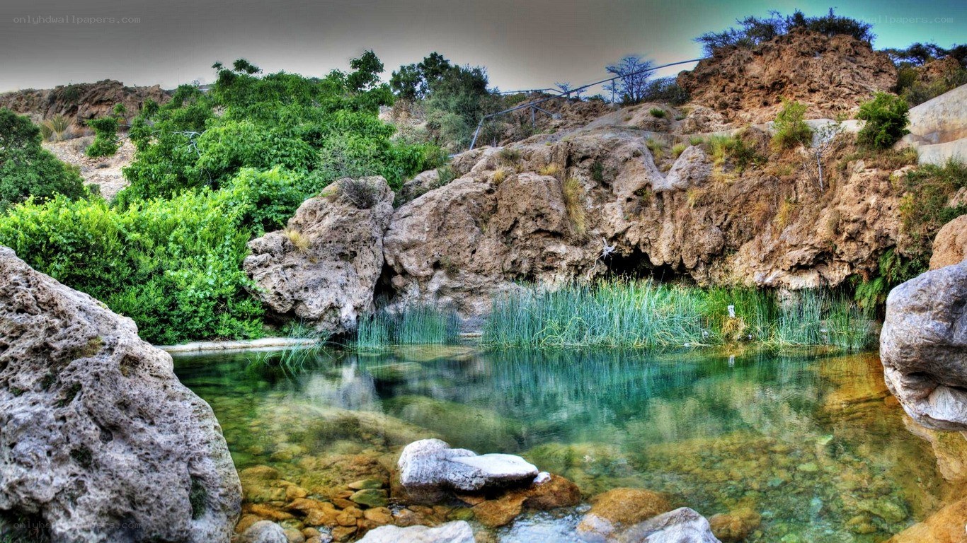 Clear pool in rocky landscape