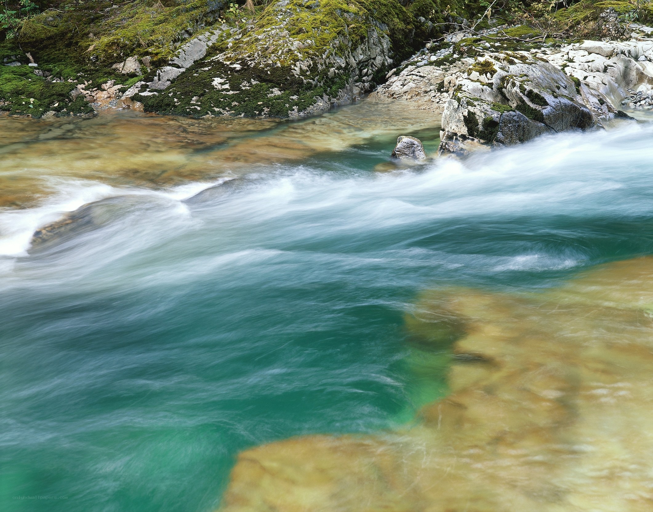 Clear river flowing over rocks