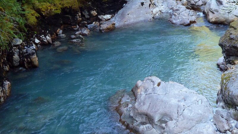 Clear River Flowing Through Rocks