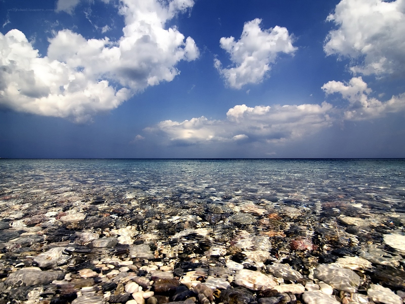 Clear sea with pebbles