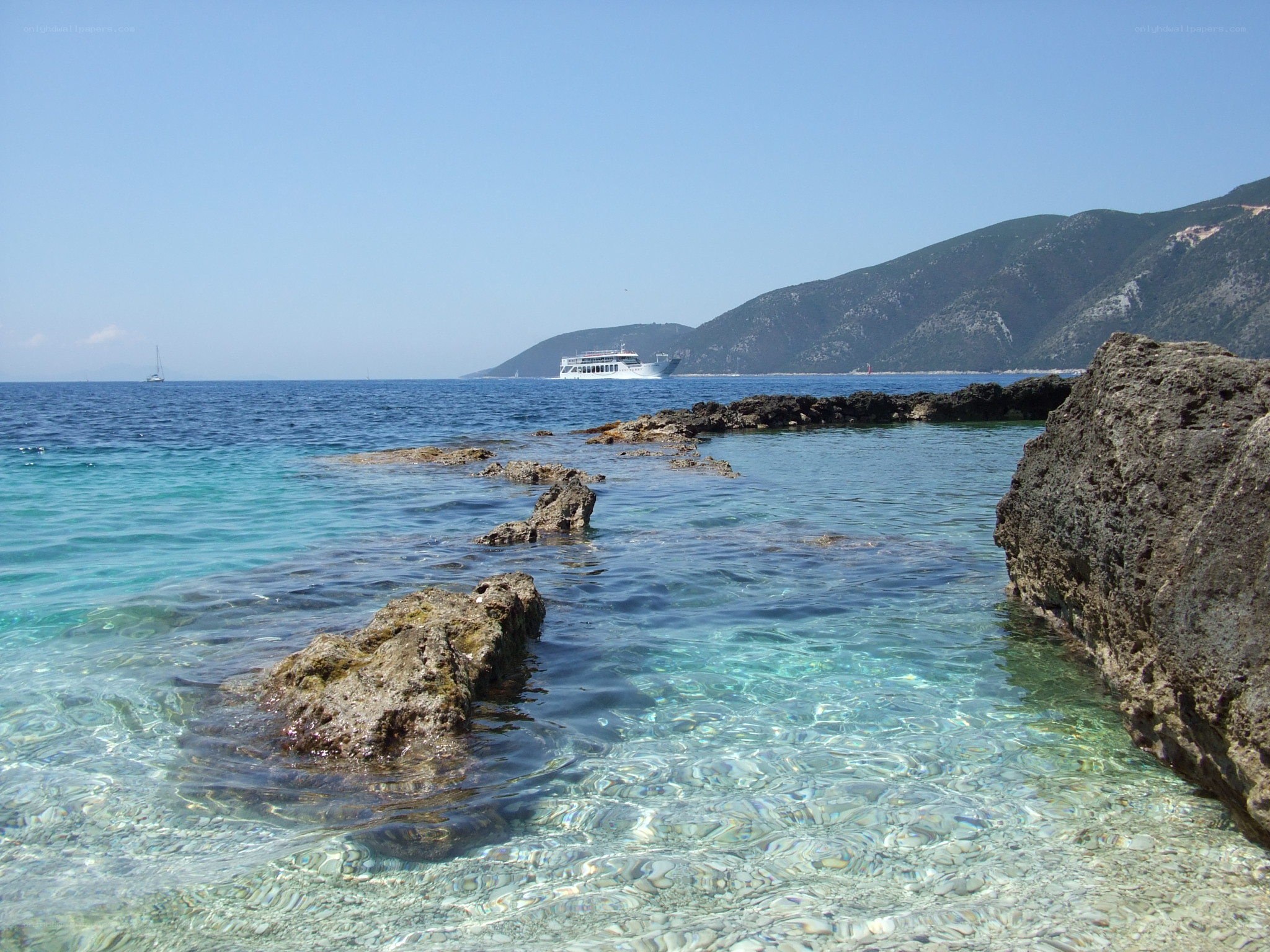 Clear sea with rocky shore